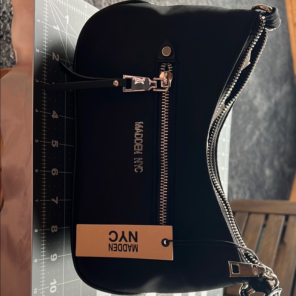 Sleek Black Shoulder Bag with Metallic Accents